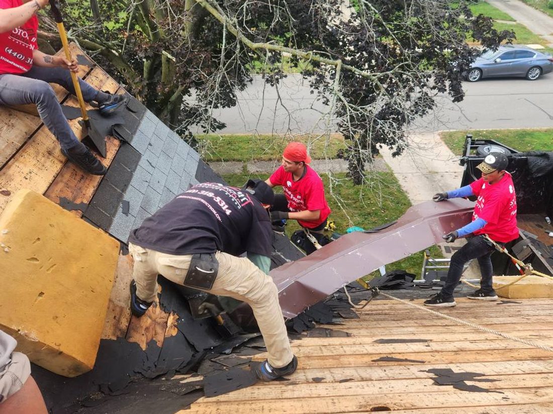 Stormfront crew performing a roof tear-off