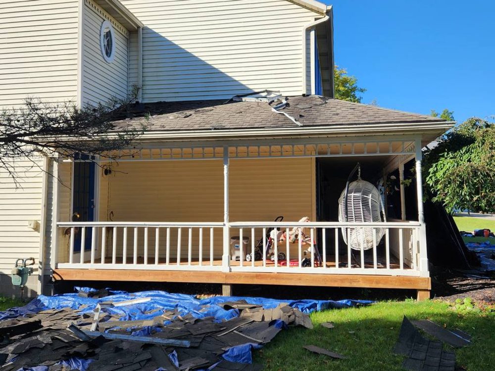 Home with porch and new roof work